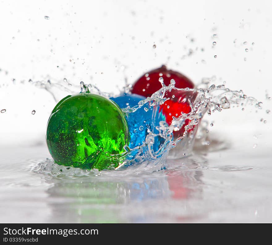 Water spheres frozen action on white background. Water spheres frozen action on white background