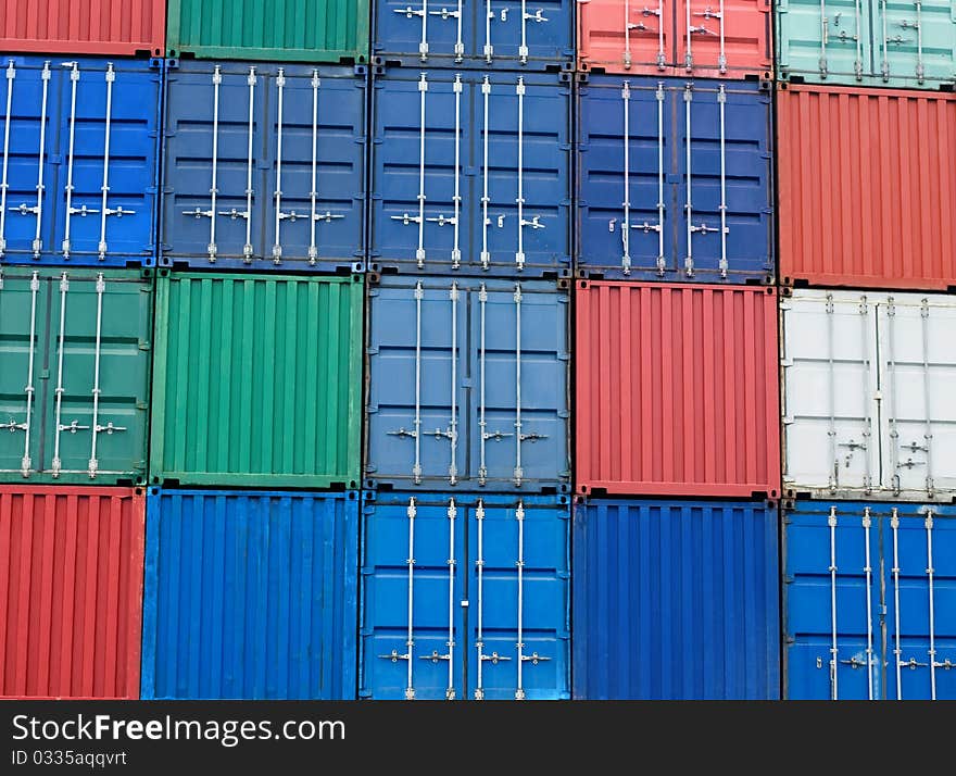 Background of multi-colored freight shipping containers at the docks. Background of multi-colored freight shipping containers at the docks