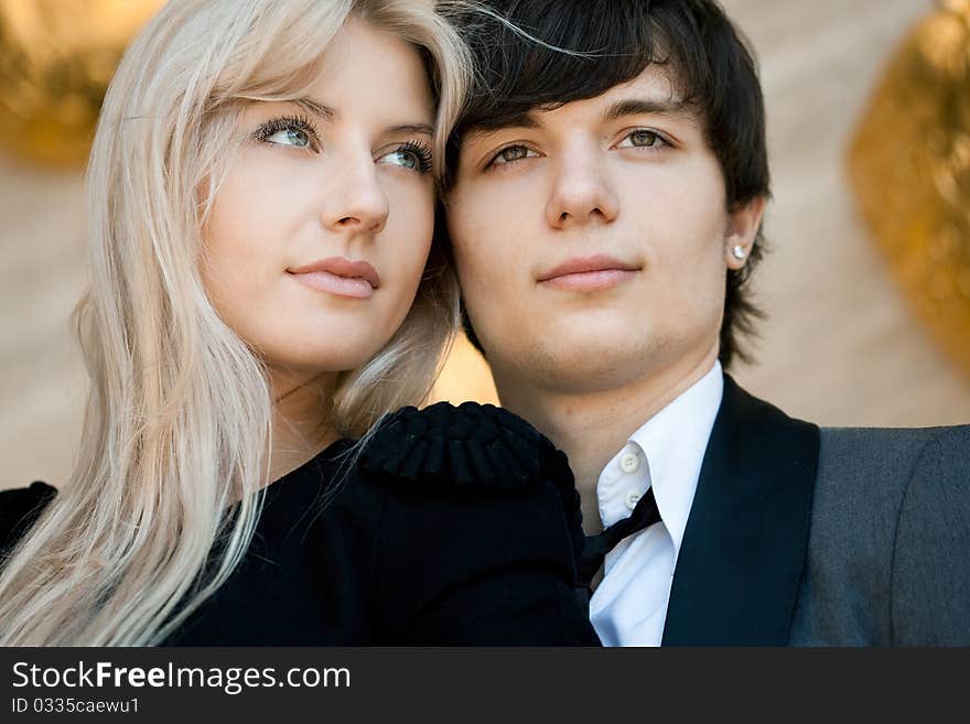 Couple - girl and guy near the wall