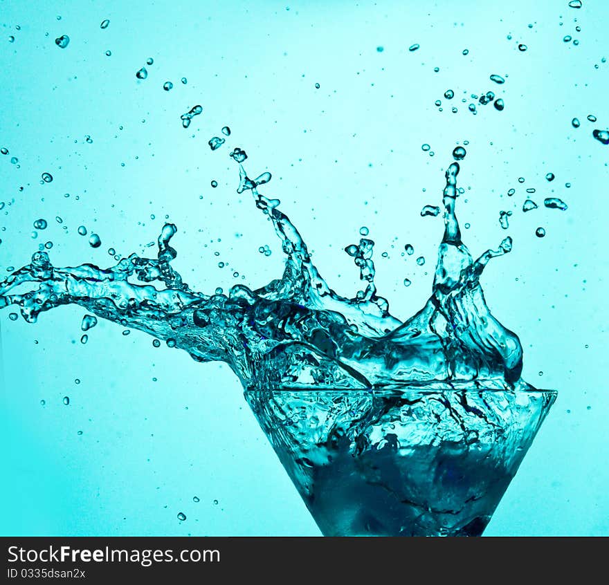 Drink splashes on blue background. Drink splashes on blue background