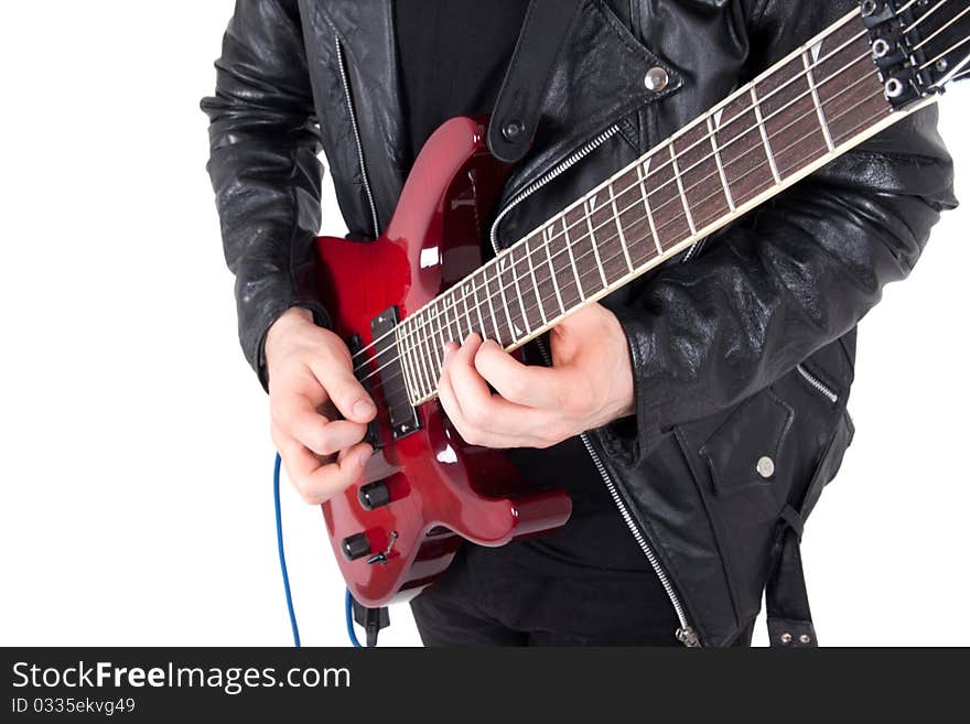 Rocker playing guitar isolated on white background