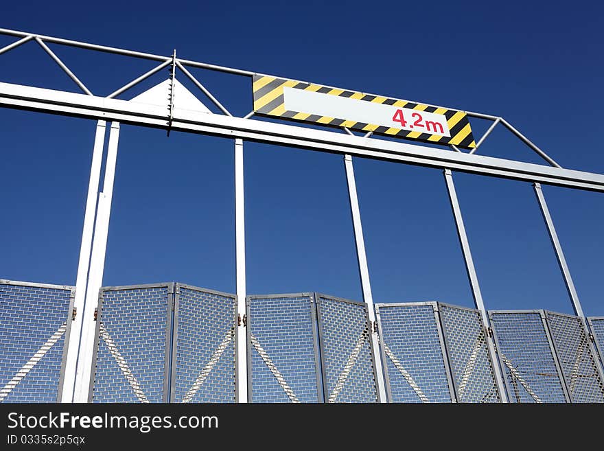 Construction site gate and blue sky