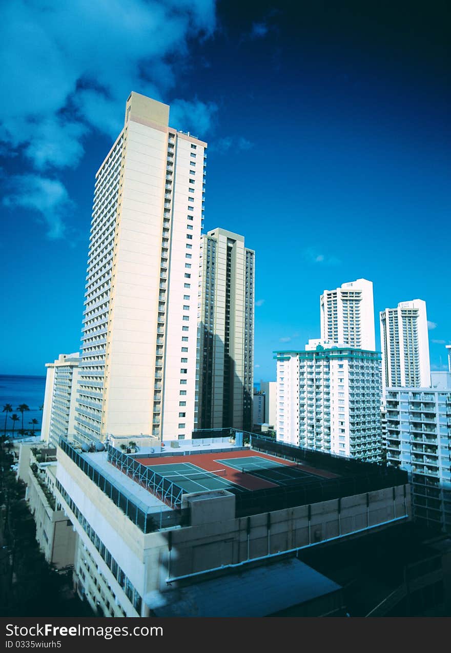 High building and sports ground in city. High building and sports ground in city