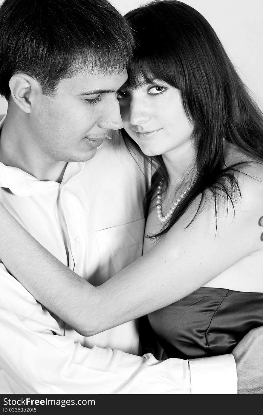 Desaturated portrait of love couple in studio