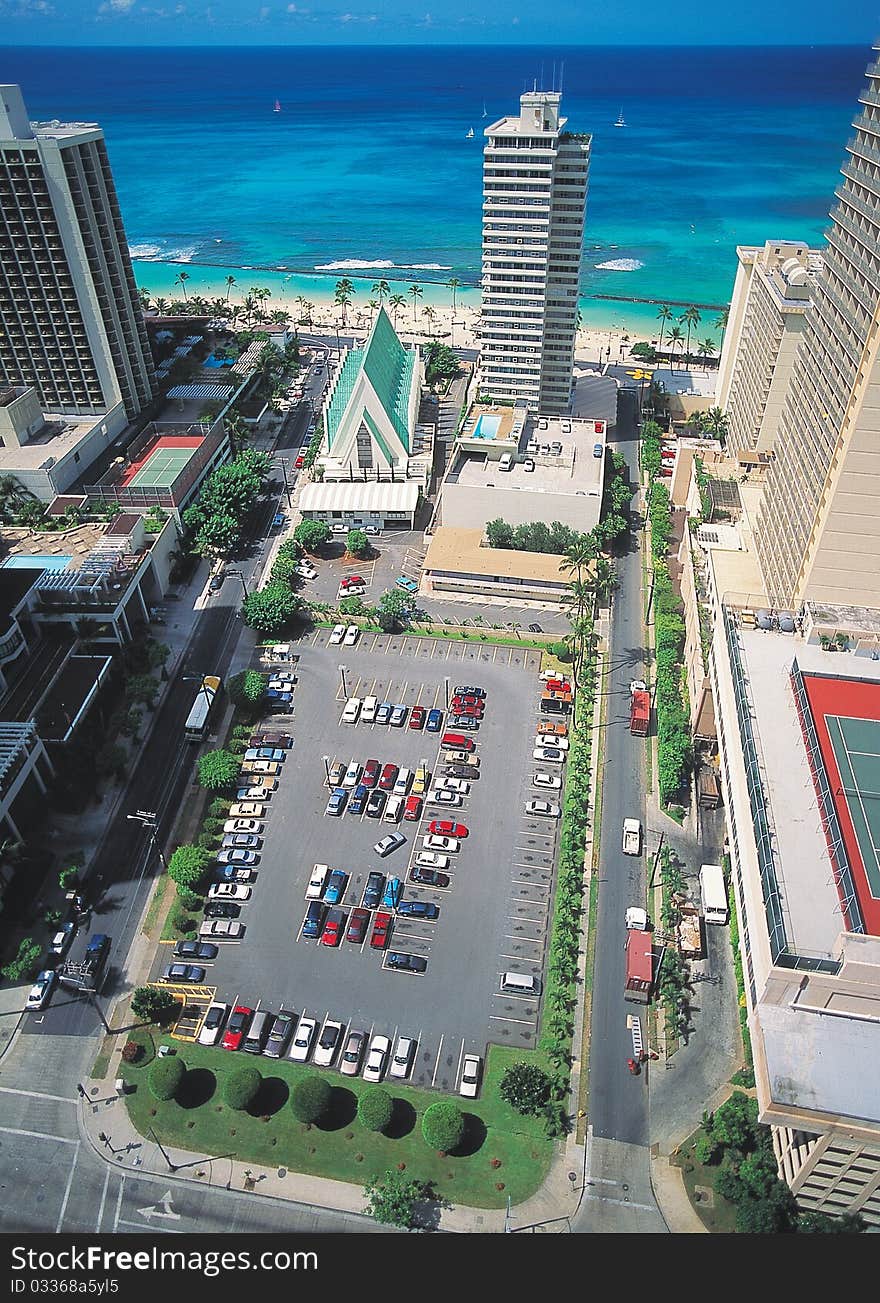 High angle view of high building and parking lot. High angle view of high building and parking lot