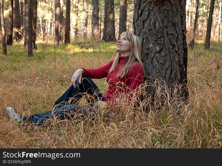 Woman Sits Near Tree