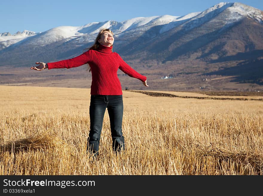 Beauty funny woman on a field