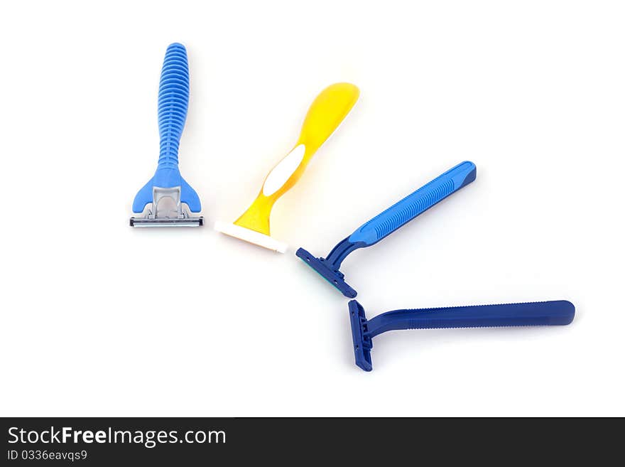 Blue and yellow razor isolate on white background.