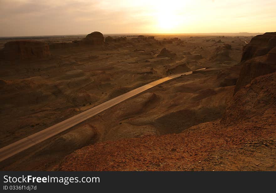 A road in mountain,at sunset.Xingjiang province,China.