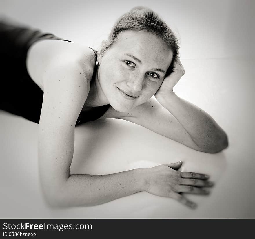 Young happy woman in sport wear. Black and white