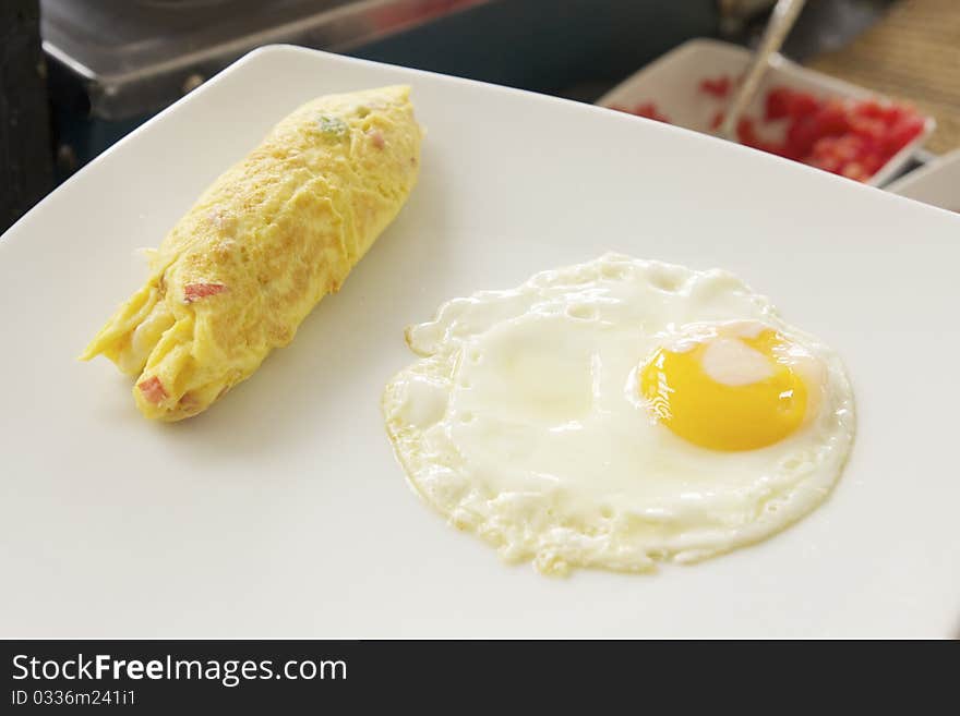 Closeup of freshly cooked eggs on white plate. Closeup of freshly cooked eggs on white plate