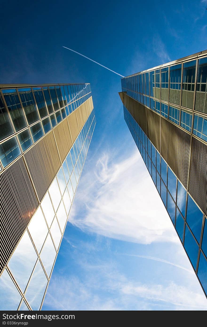 Skyscrapers in Paris (France) and the plane in the sky above them.