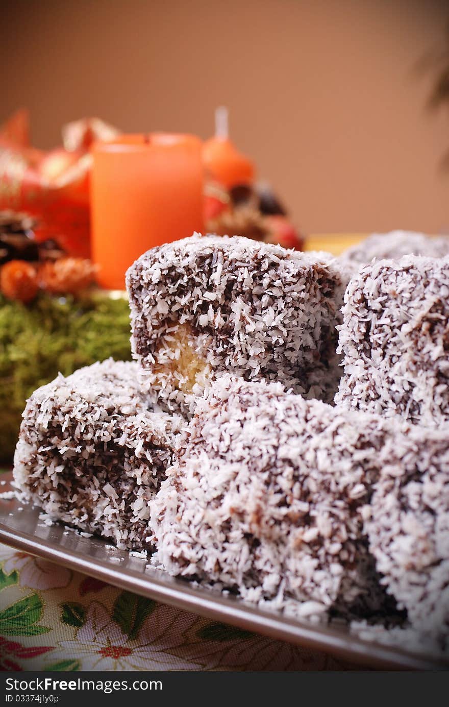 Sweet cookies and candles on background