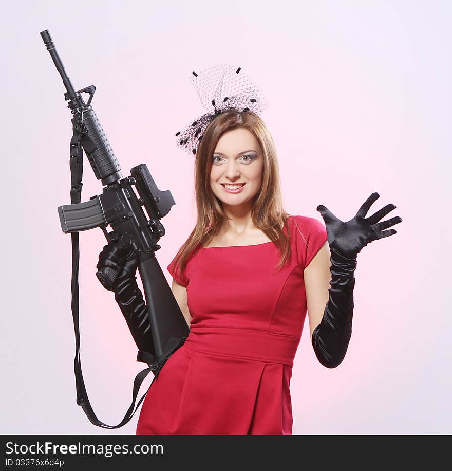 Attractive and sexy spy woman with assault rifle