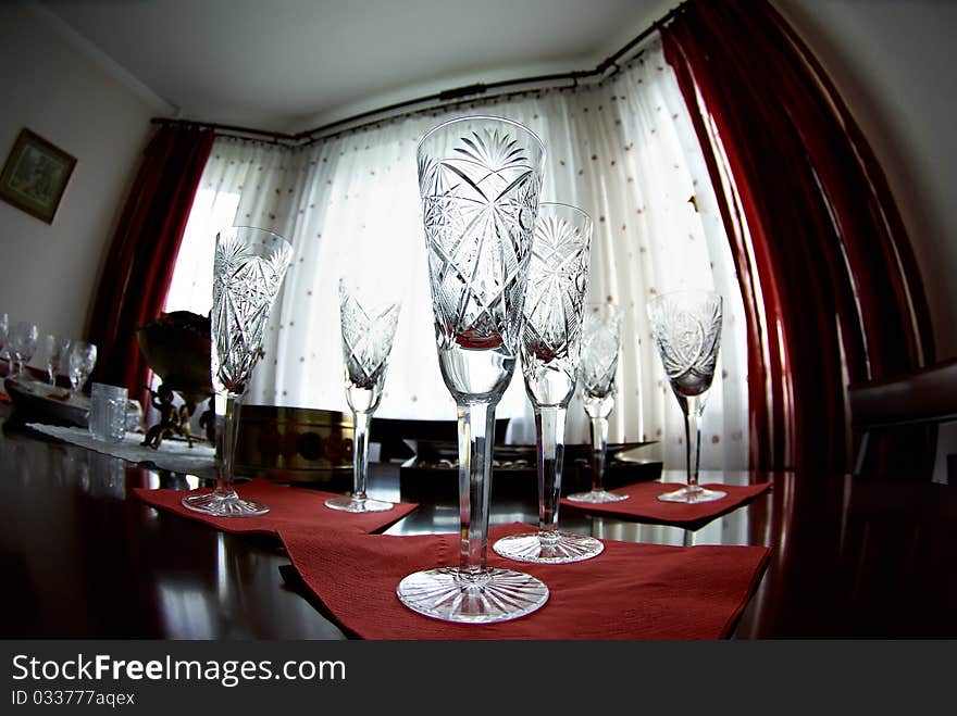 Wine glasses on the red napkins on festive table