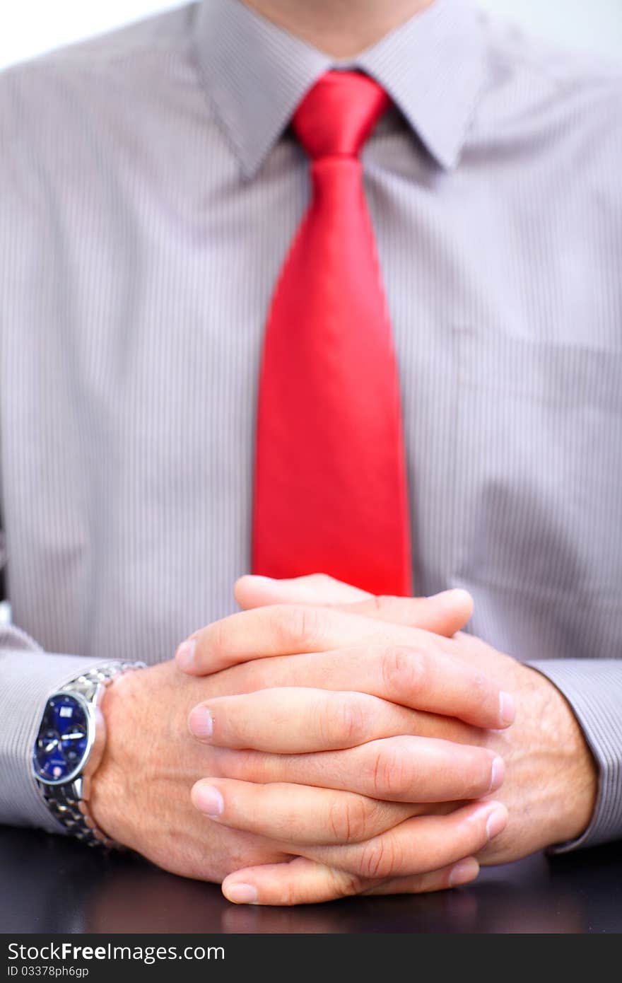 Hands of a businessman. Red tie