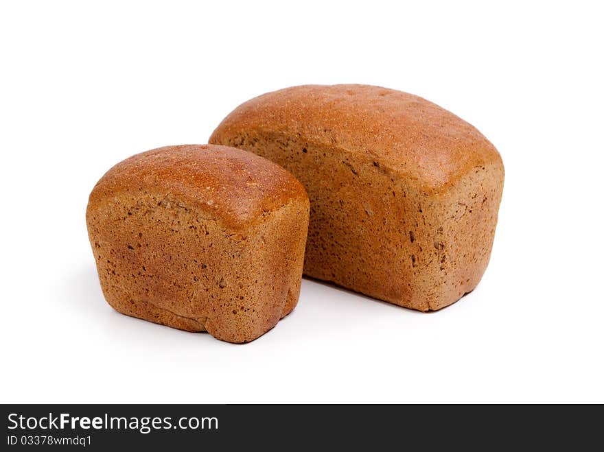 Loaf of brown bread isolated on white