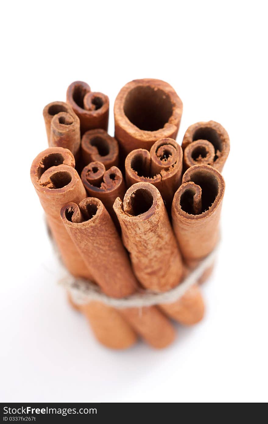 Group of cinnamon sticks white background