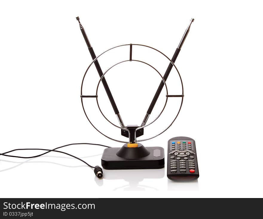 Indoor antenna and remote control TV isolated on a white background. Indoor antenna and remote control TV isolated on a white background