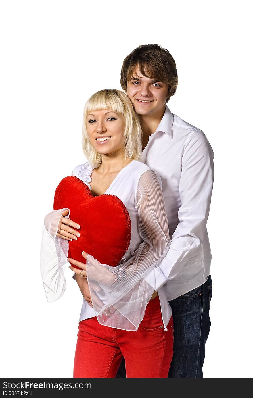 Young happy couple with red heart. isolated on white. Young happy couple with red heart. isolated on white