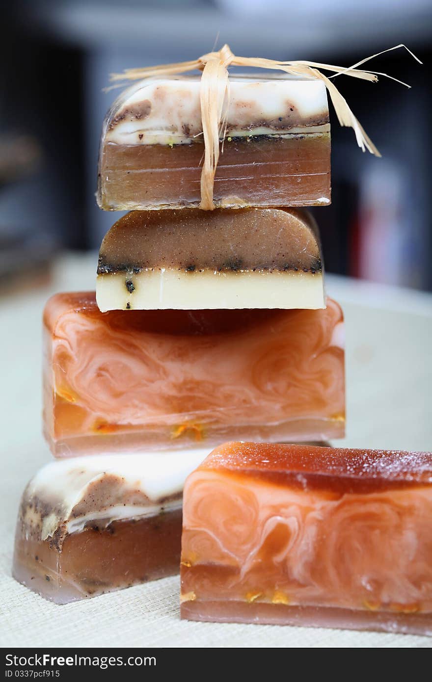 Handmade stacked soap bars on gray background