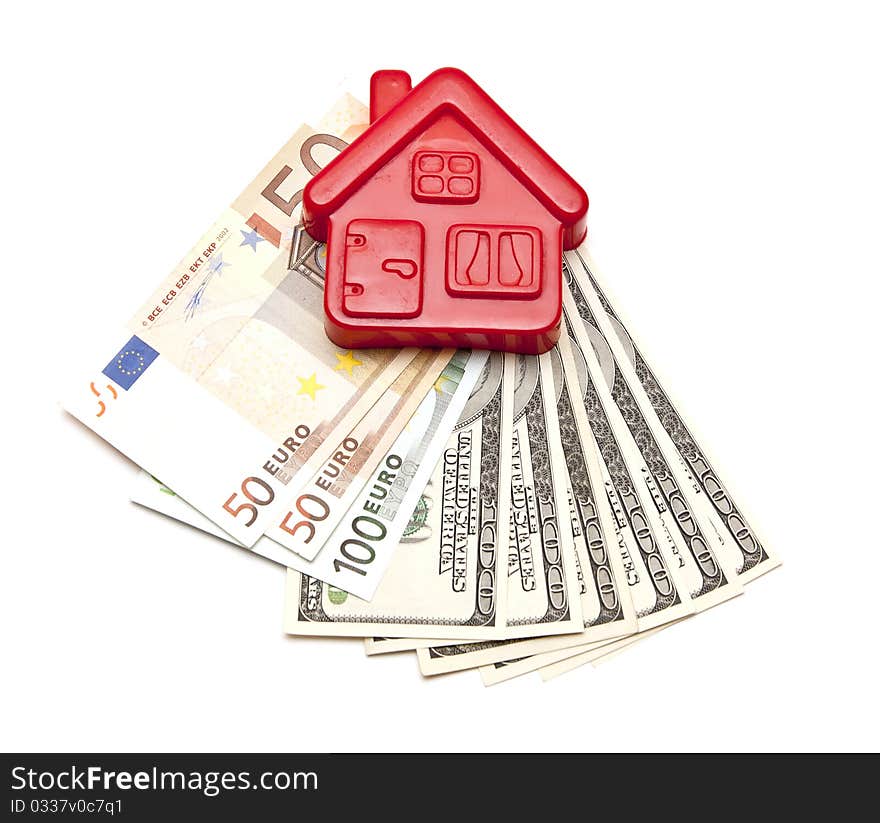 House on top of a money over white background