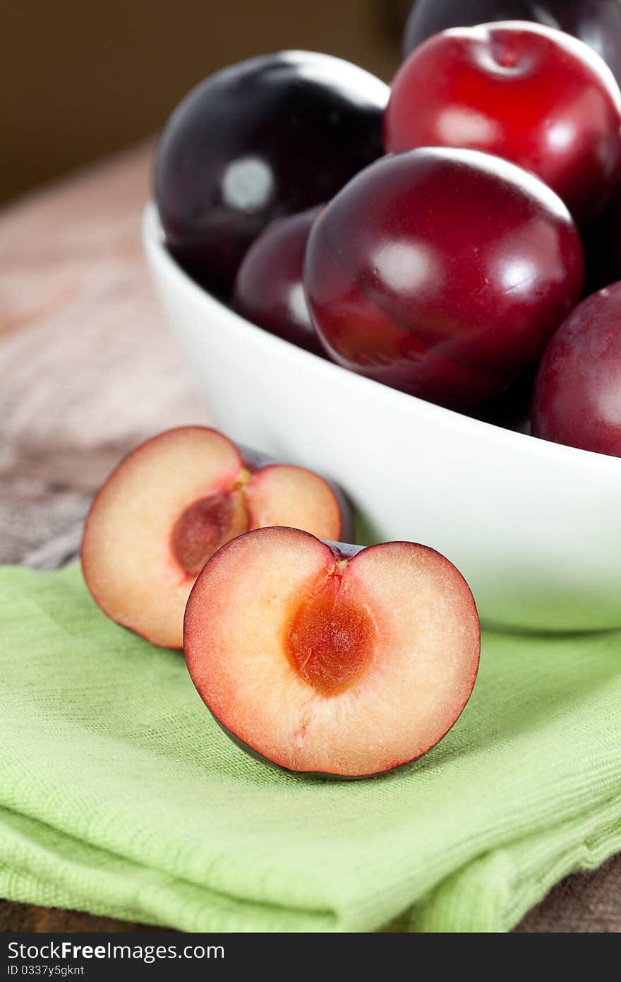 Red plums in bowl