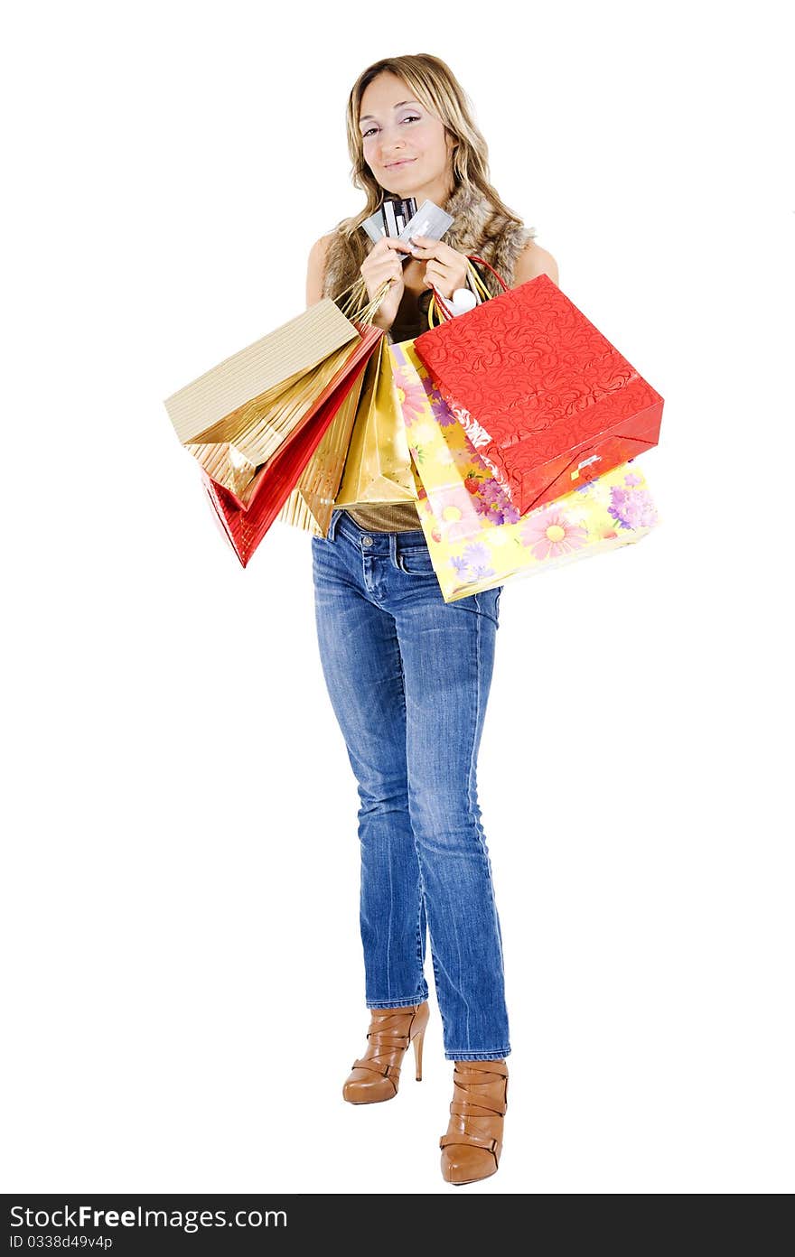 Sexy blond woman with shopping bags smiling happily