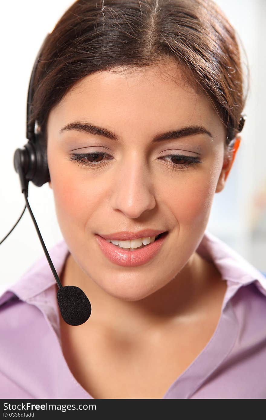 Beautiful Young Female Secretary Wearing Headset