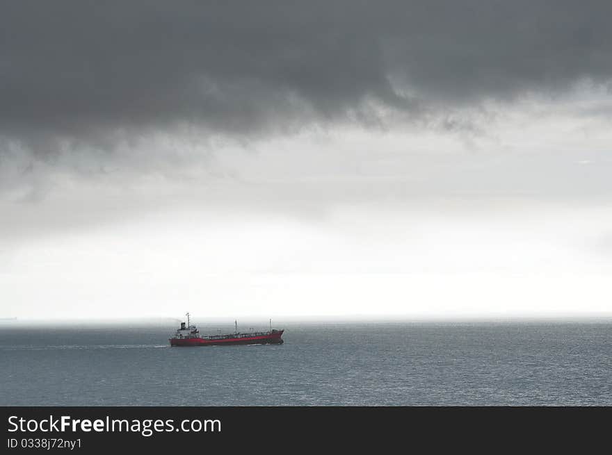 Lone Ship Braving Stormy Weather