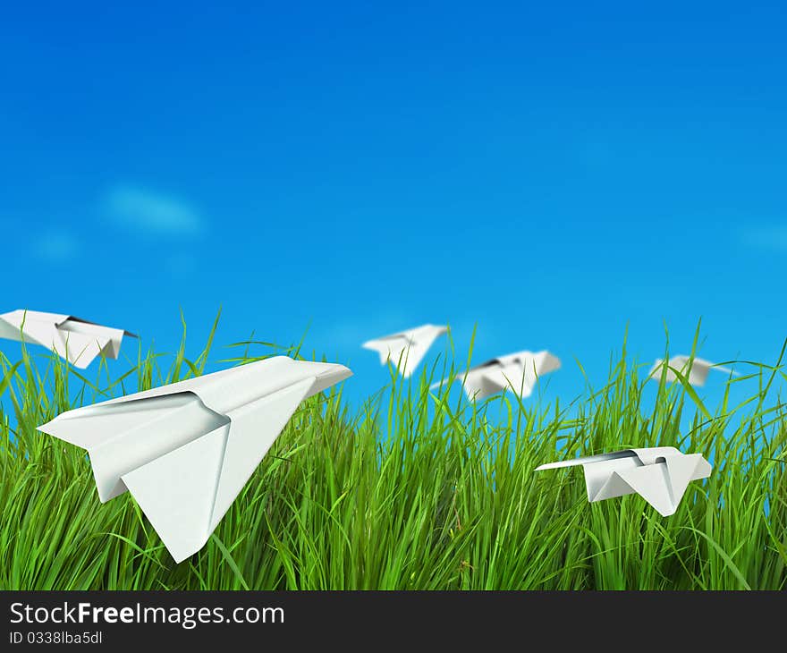 Landscape with clouds, green field and paper planes