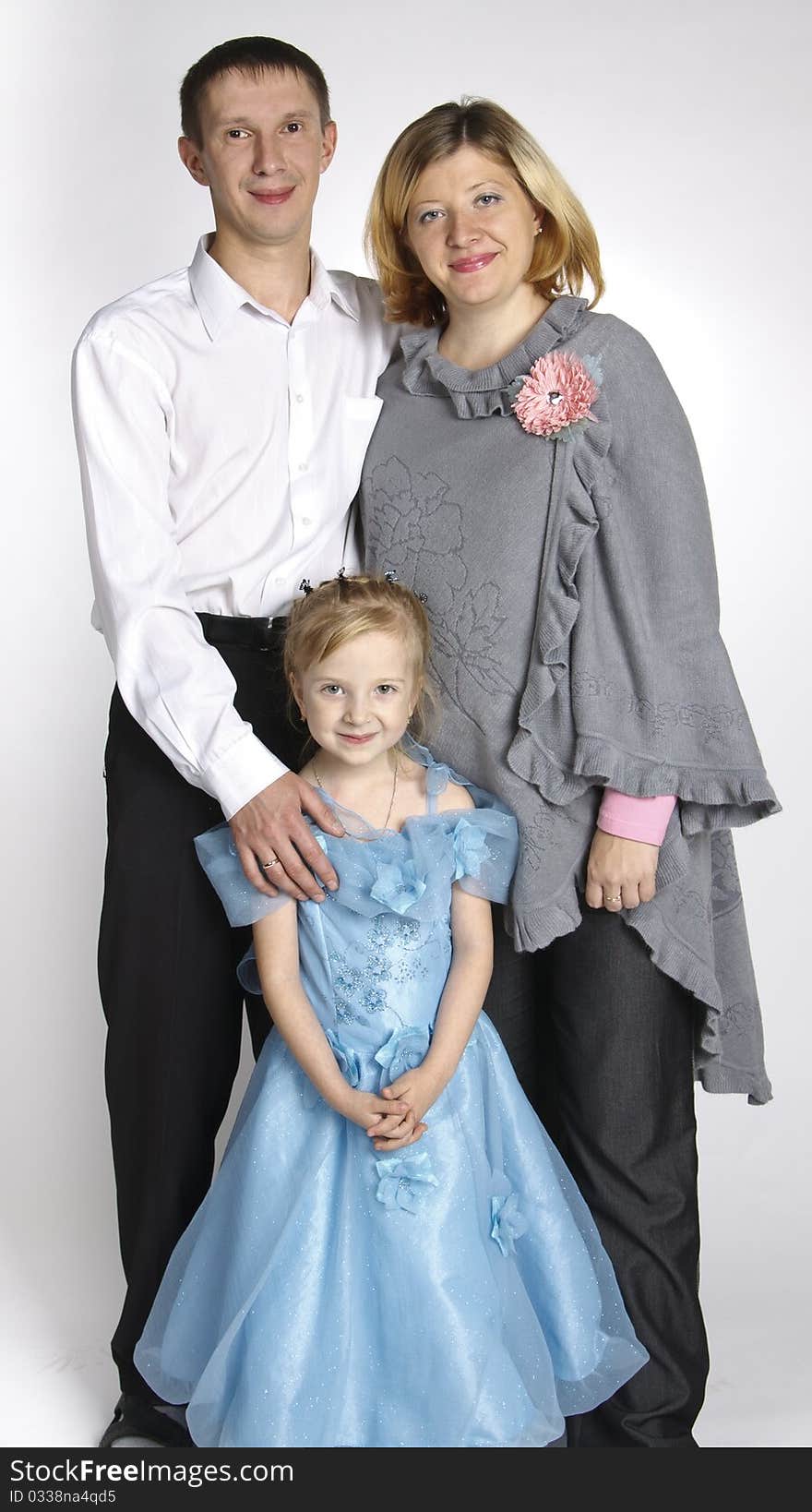 Family portrait, the woman, the man and the girl of 5 years