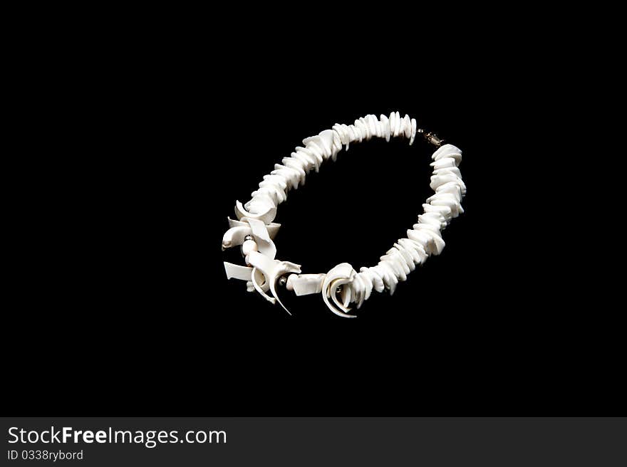 Sea shell bangle isolated on black