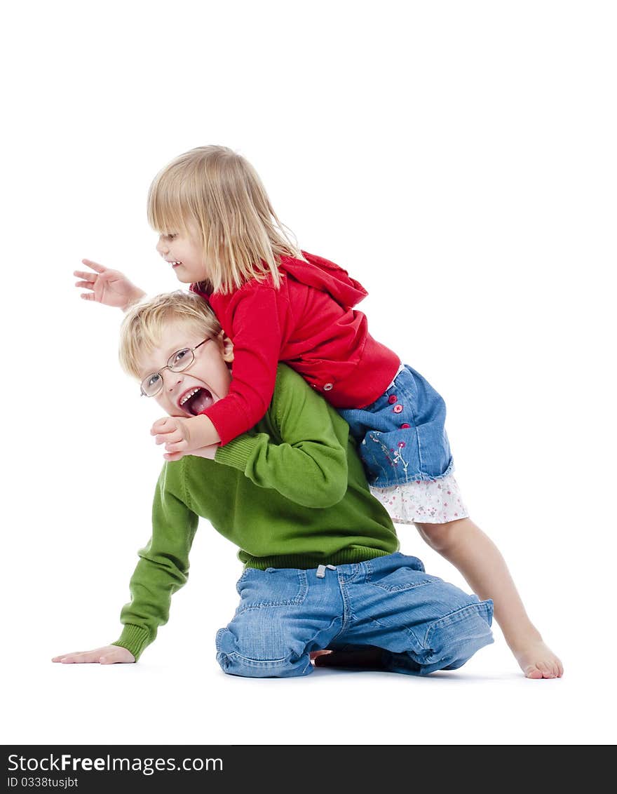 Two young siblings fooling around with each other - isolated on white. Two young siblings fooling around with each other - isolated on white