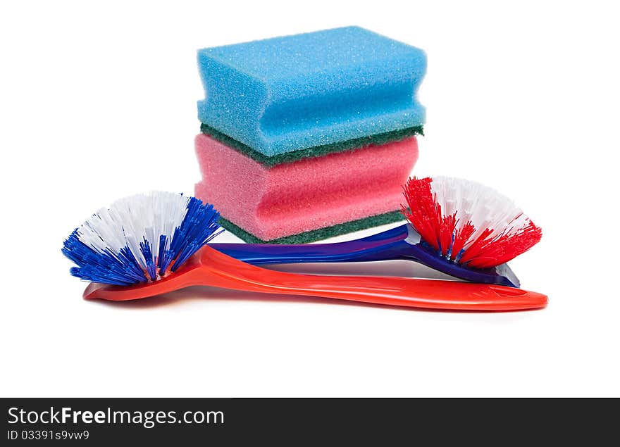 Cleaning brushes and kitchen sponges isolated on a white background. Cleaning brushes and kitchen sponges isolated on a white background.