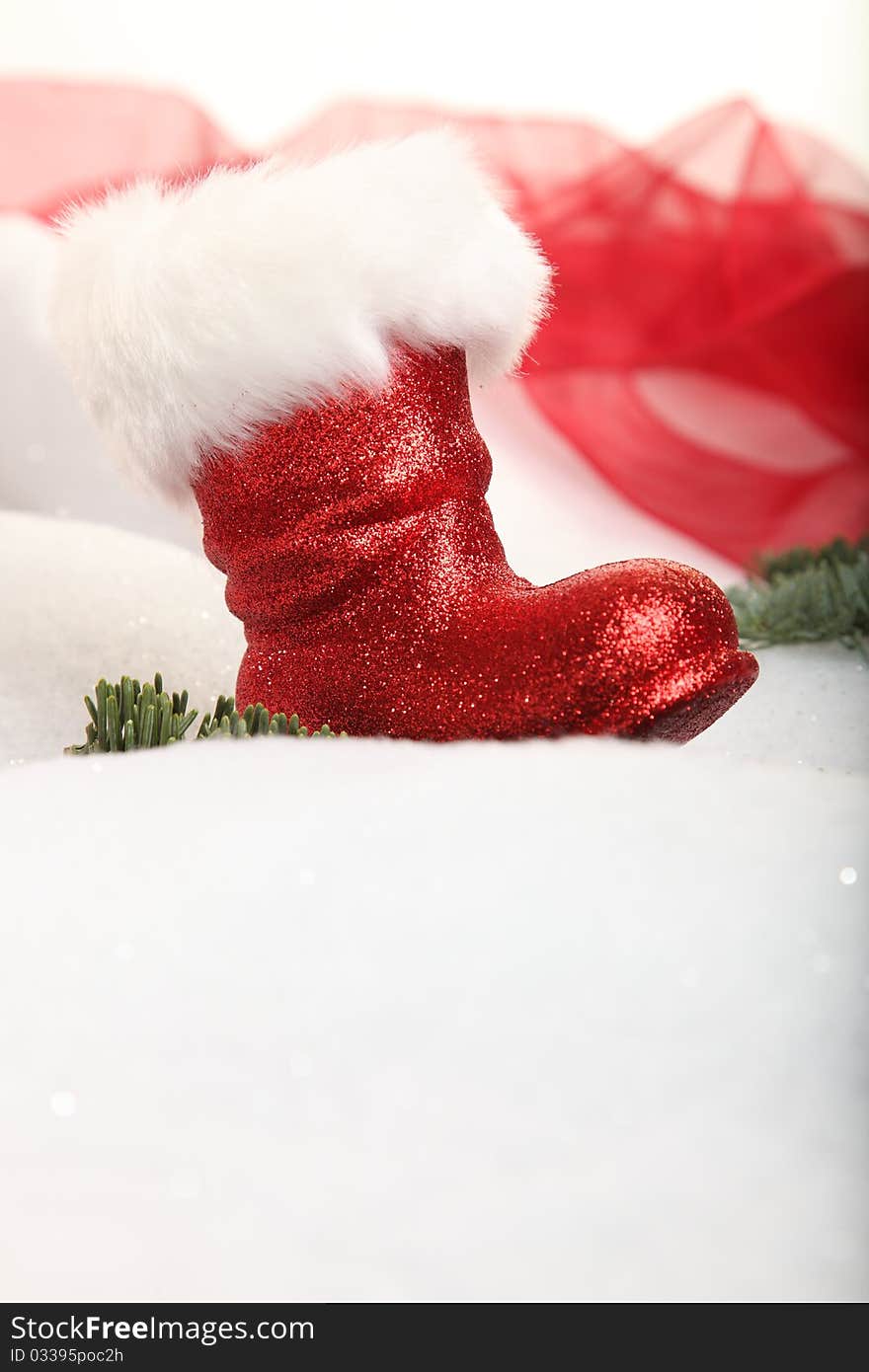 A Christmas boot in a winter landscape with copyspace. A Christmas boot in a winter landscape with copyspace