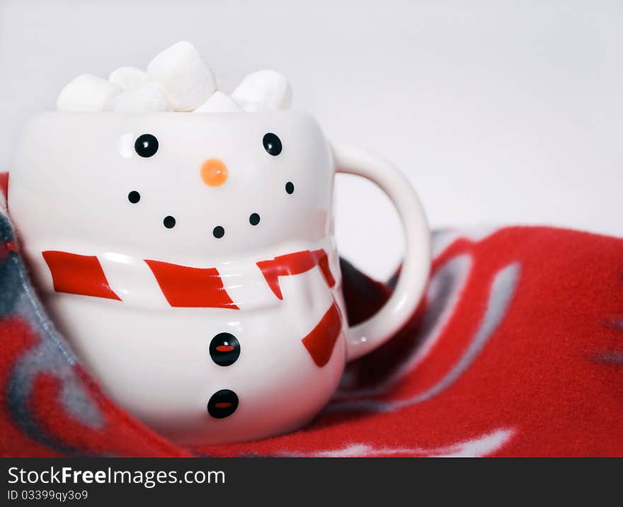 Hot cocoa with marshmallows in snowman mug