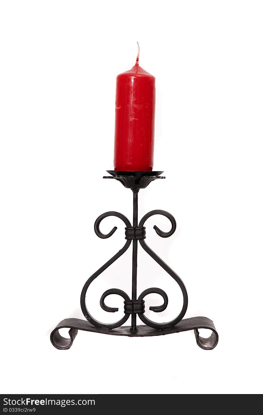 Wrought iron candle holder with one red candle. Wrought iron candle holder with one red candle