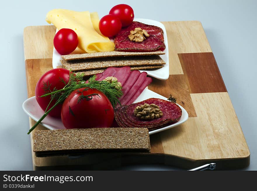 Allsorts meat on a plate with vegetables