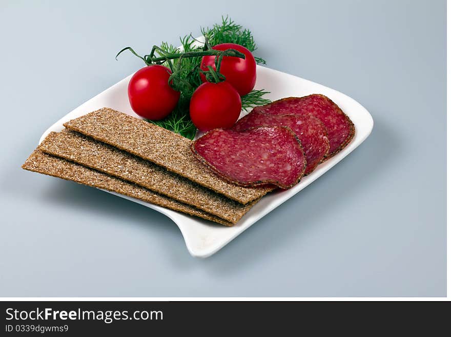 Allsorts meat on a plate with vegetables