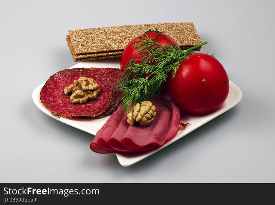 Allsorts meat on a plate with vegetables