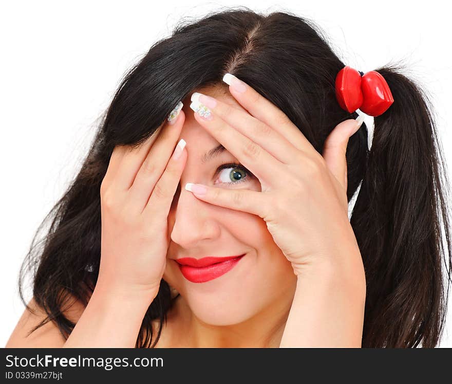 Smiling girl to peep at somebody, isolated on white