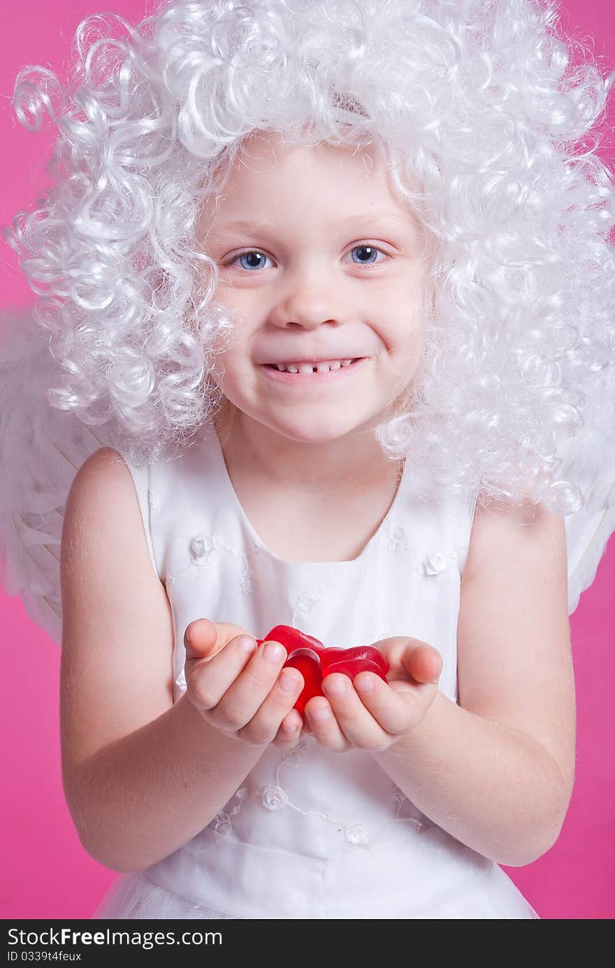 Little angel on pink background