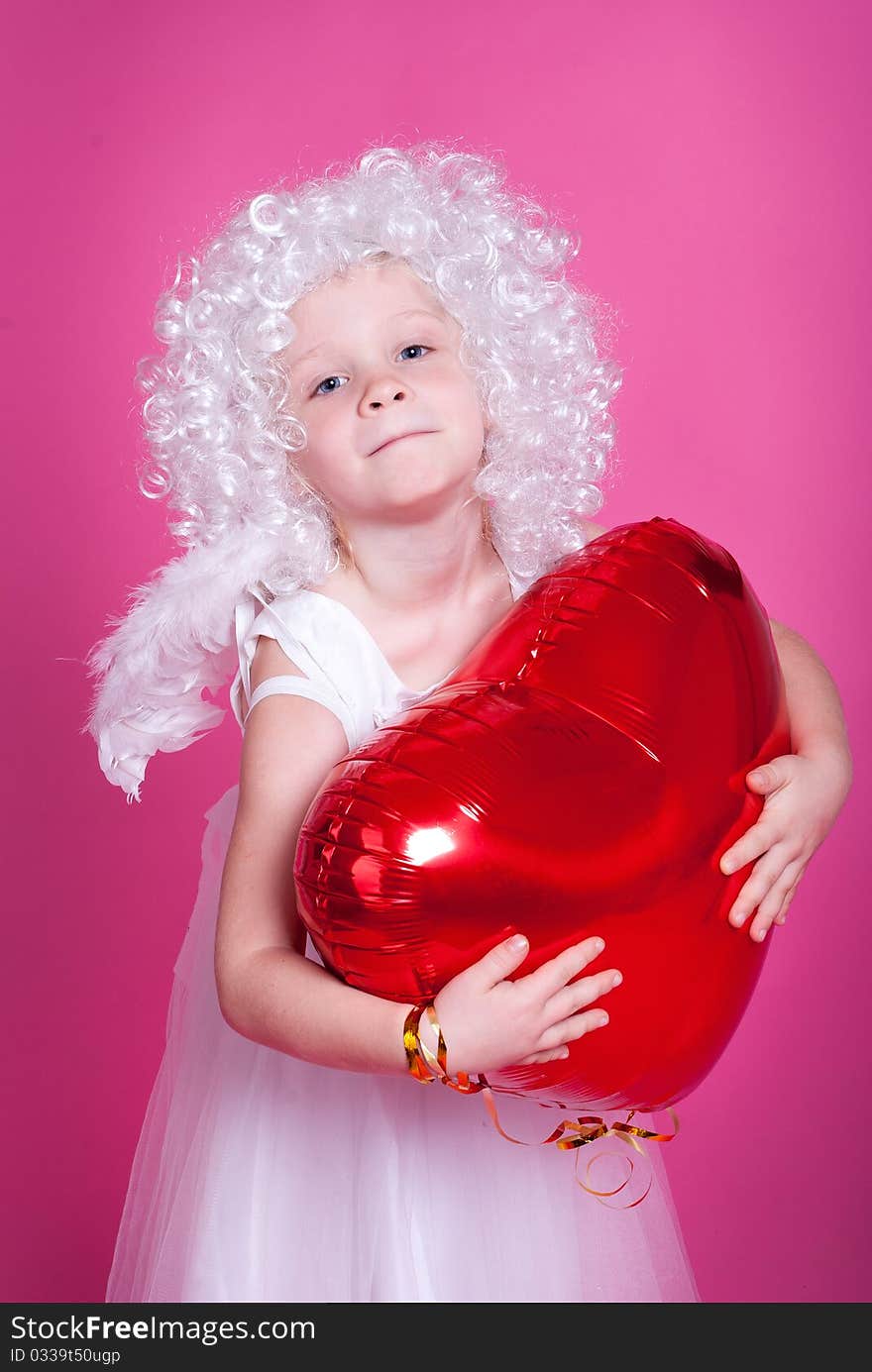 Little angel on pink background