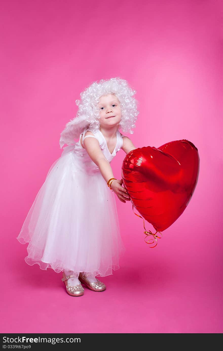 Little angel on pink background