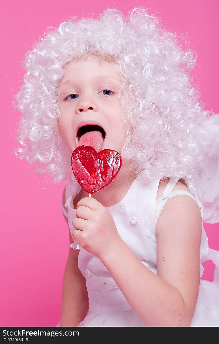 Little angel on pink background