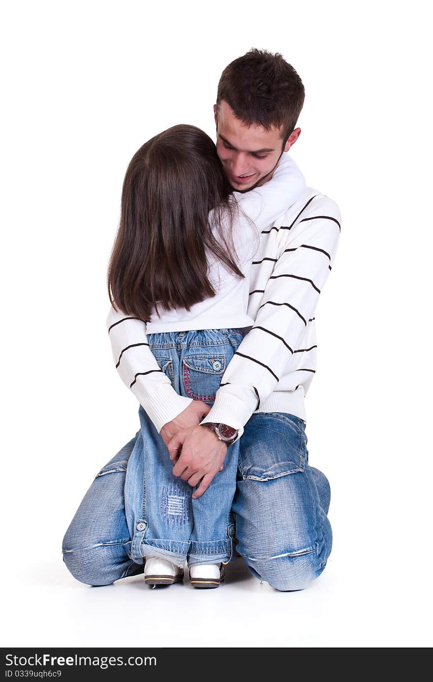 Dad  hugs his little daughter, isolated. Dad  hugs his little daughter, isolated