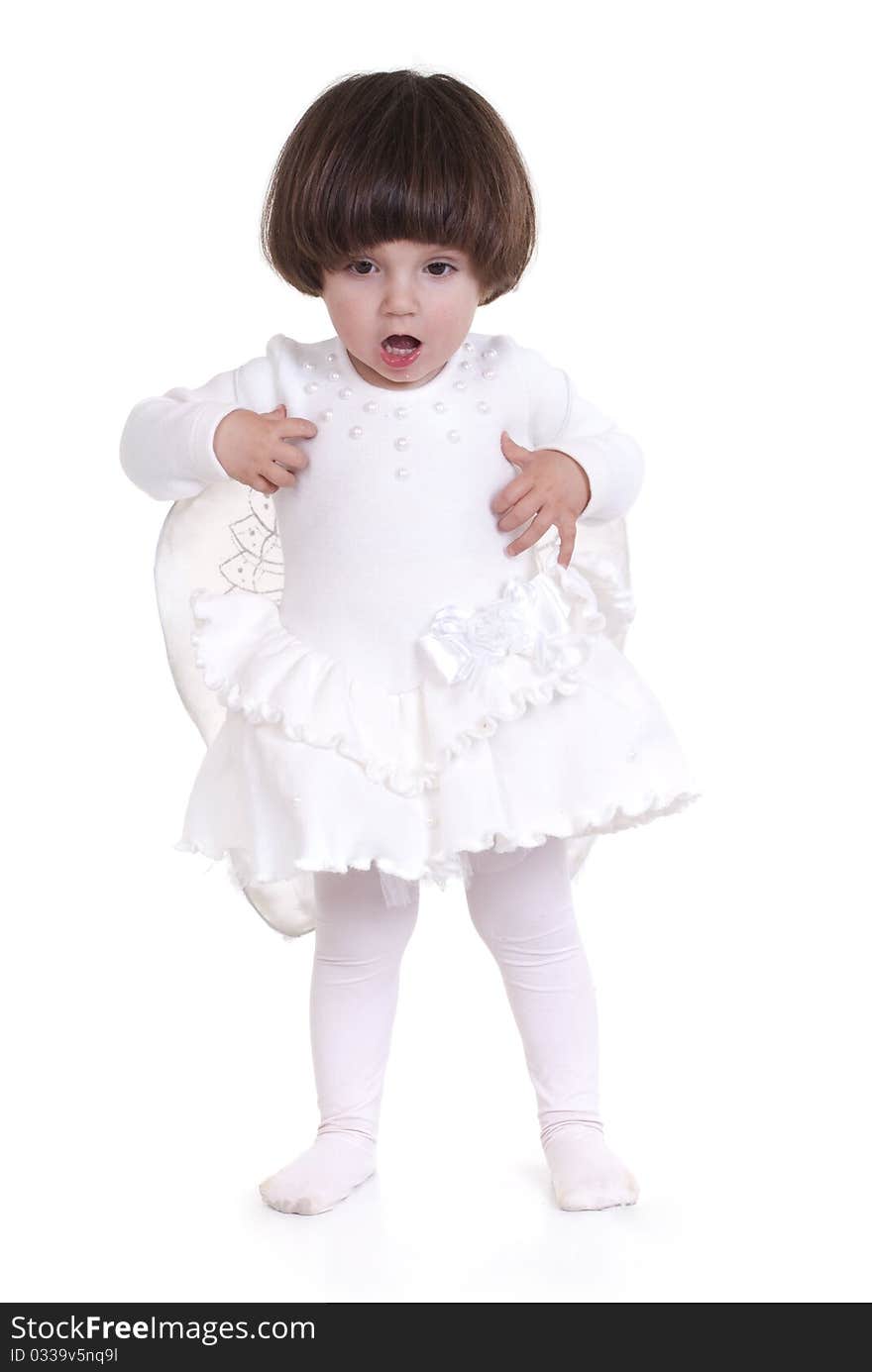 Portrait of a little girl dressed as an angel with white dress