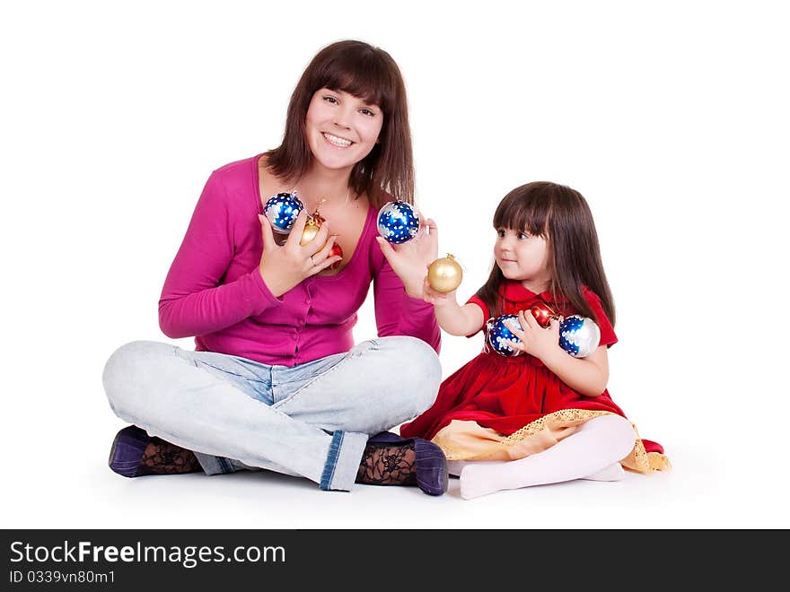 Mom and daughter play with New Year balls