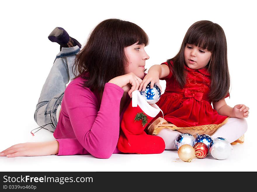 Mom and daughter play with New Year balls